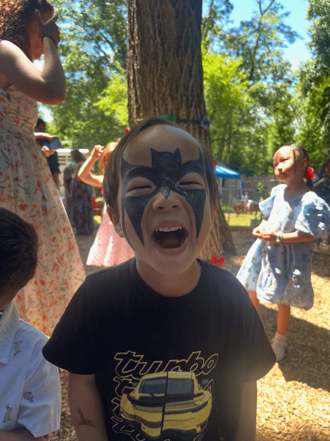 A child with face paint at Beacon Montessori summer camp in Weston, MA