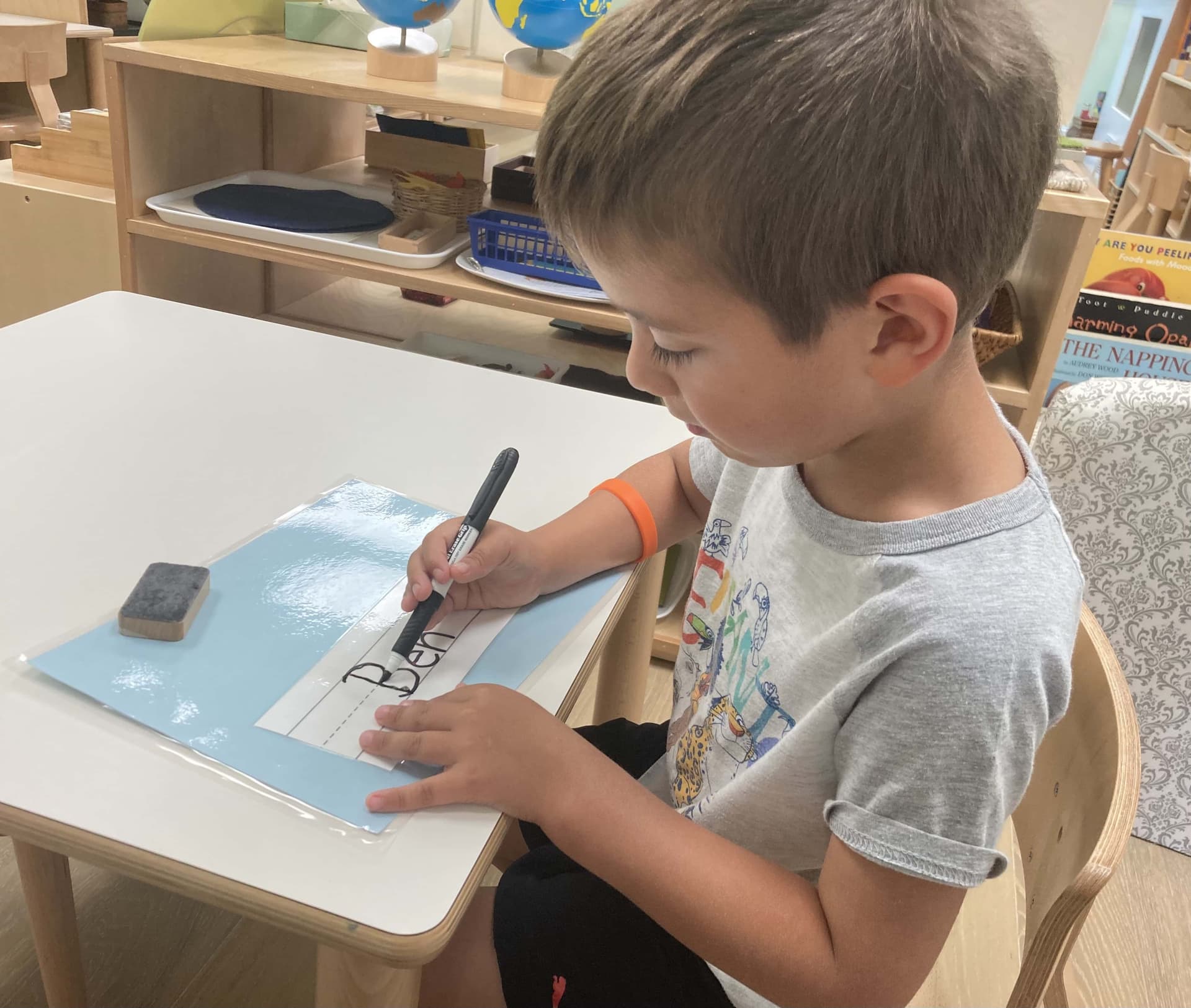 A child focused on a Montessori activity
